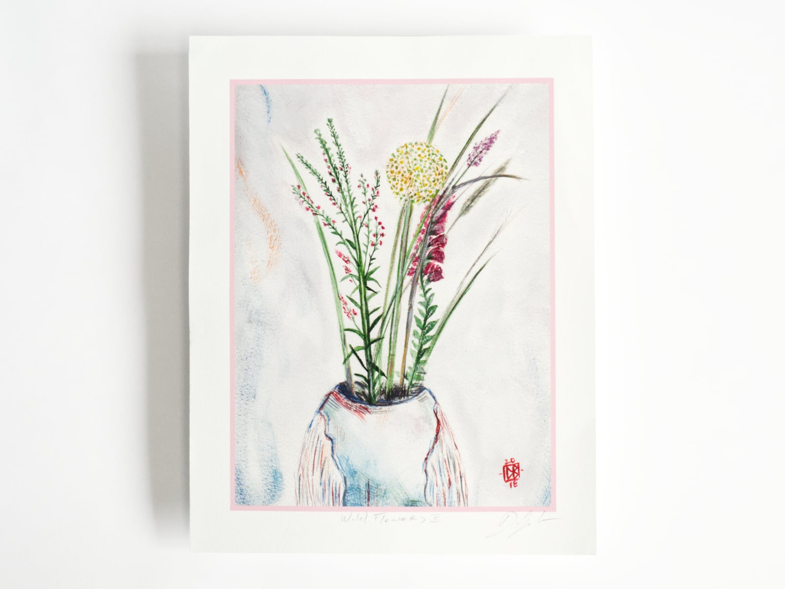 An art print featuring painted wildflowers in a vase